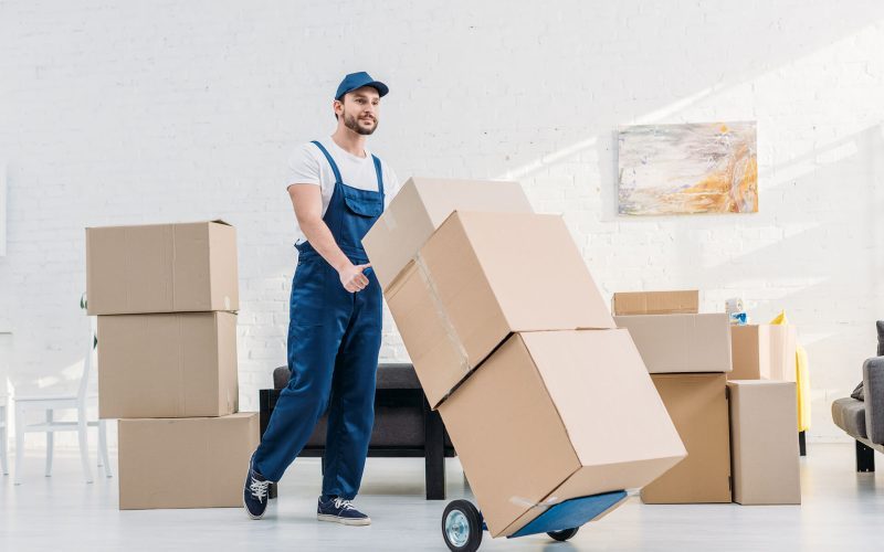 Mover In Uniform Transporting Cardboard Boxes On X6KAQDN Rb5ceg9k1vh3br47x0st7wqmkud93e4ja7agbkffd4 - Envoymovers