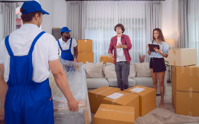 Workers Unloading Boxes From Van Outdoors Moving Service Customer Need Move New House 167657 1121 - Envoymovers